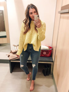 Yellow knit sweater and distressed jeans for spring